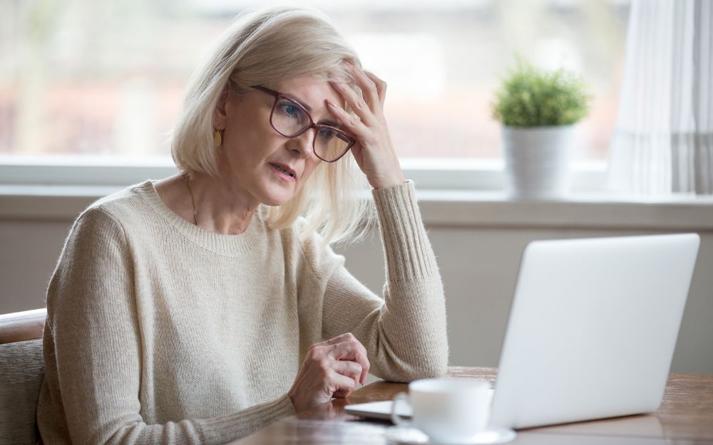 woman confused while checking laptop